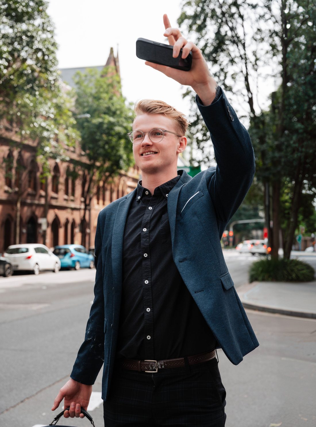 Rydo passenger hailing a taxi in the city